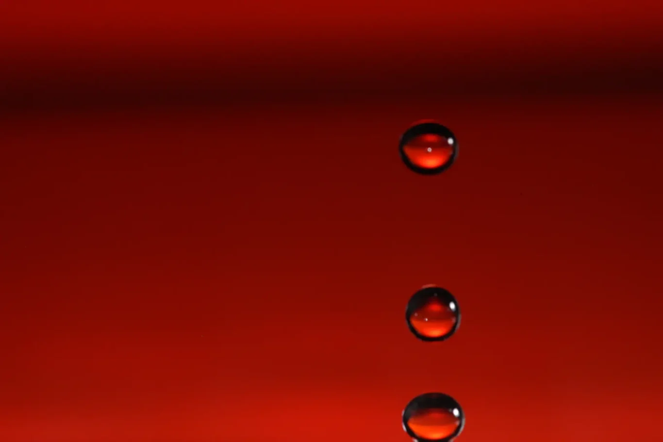Freezing Time in Red Water Droplets in High-Speed Photography