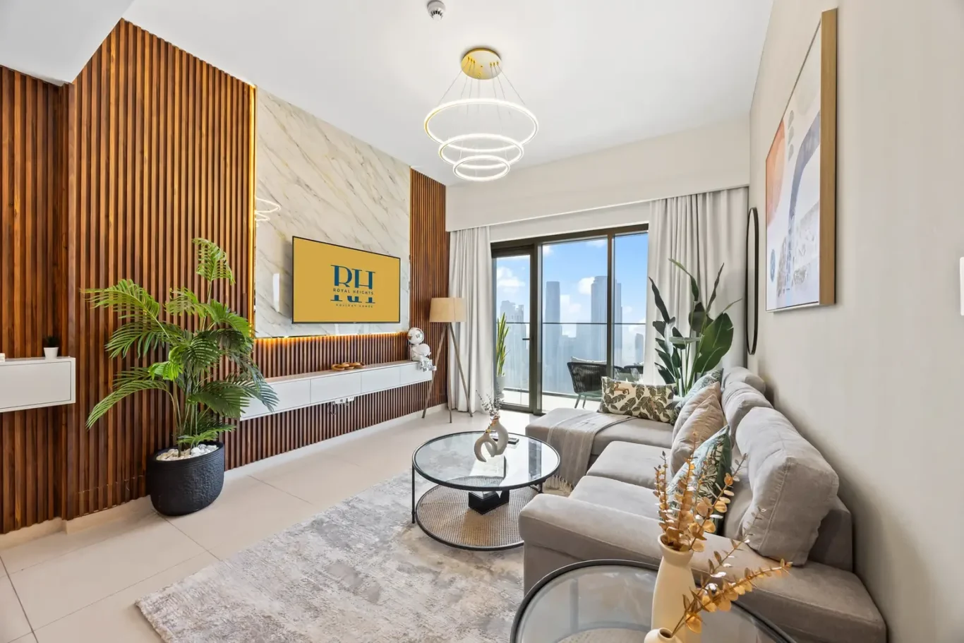Bright contemporary living room with a vertical wood slat feature wall, marble panel, and wall-mounted TV above a white console.