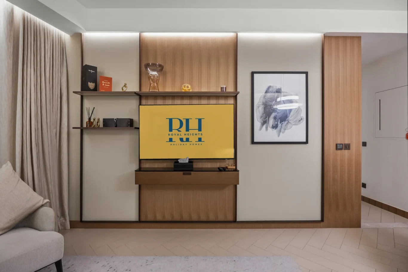 Modern living room entertainment wall with wood panels, a mounted yellow TV screen reading 'ROYAL HEIGHTS', and framed abstract art to the right; shelves with decor on the left.