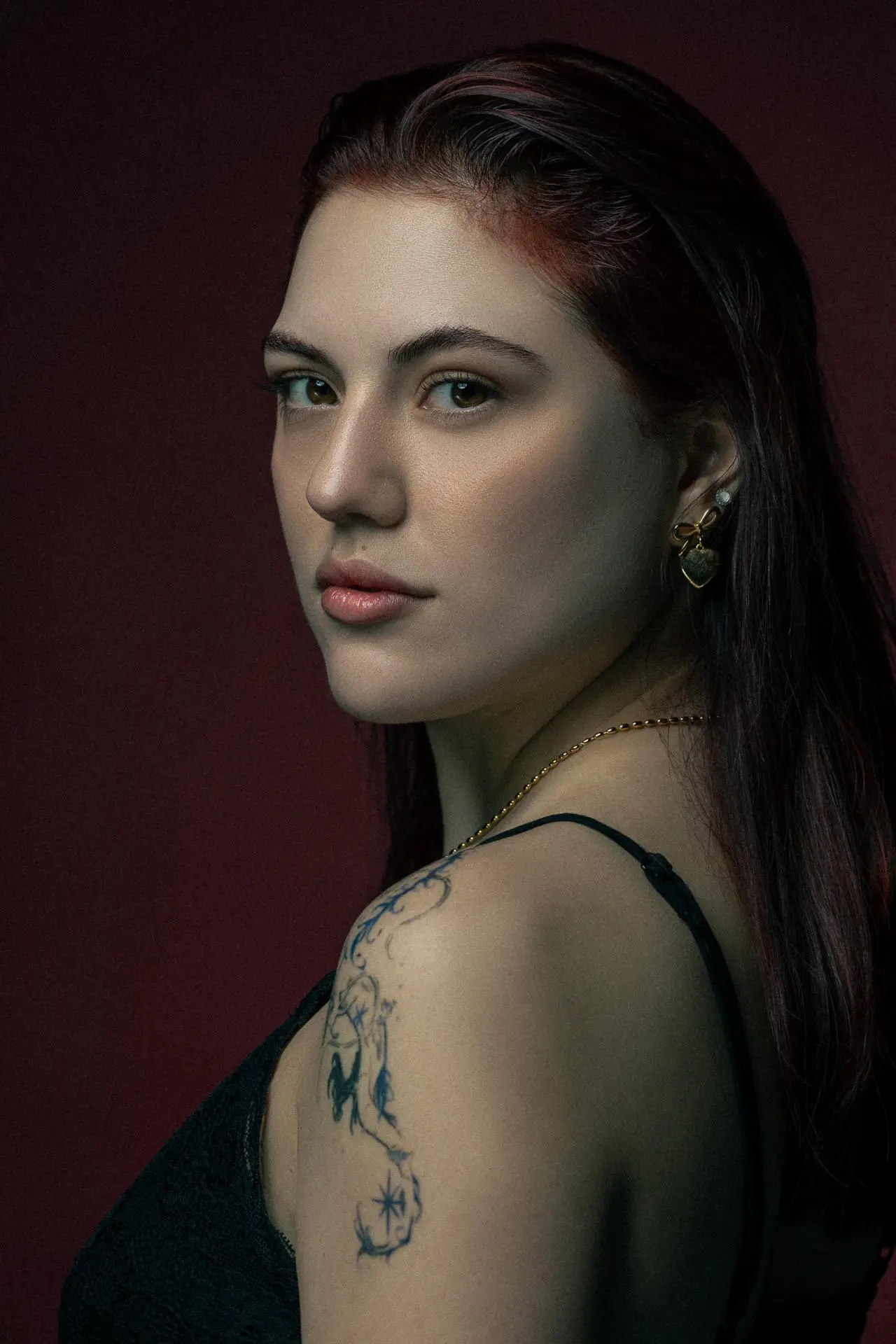 Artistic portrait photography of a woman with tattoos at a Dubai photography studio