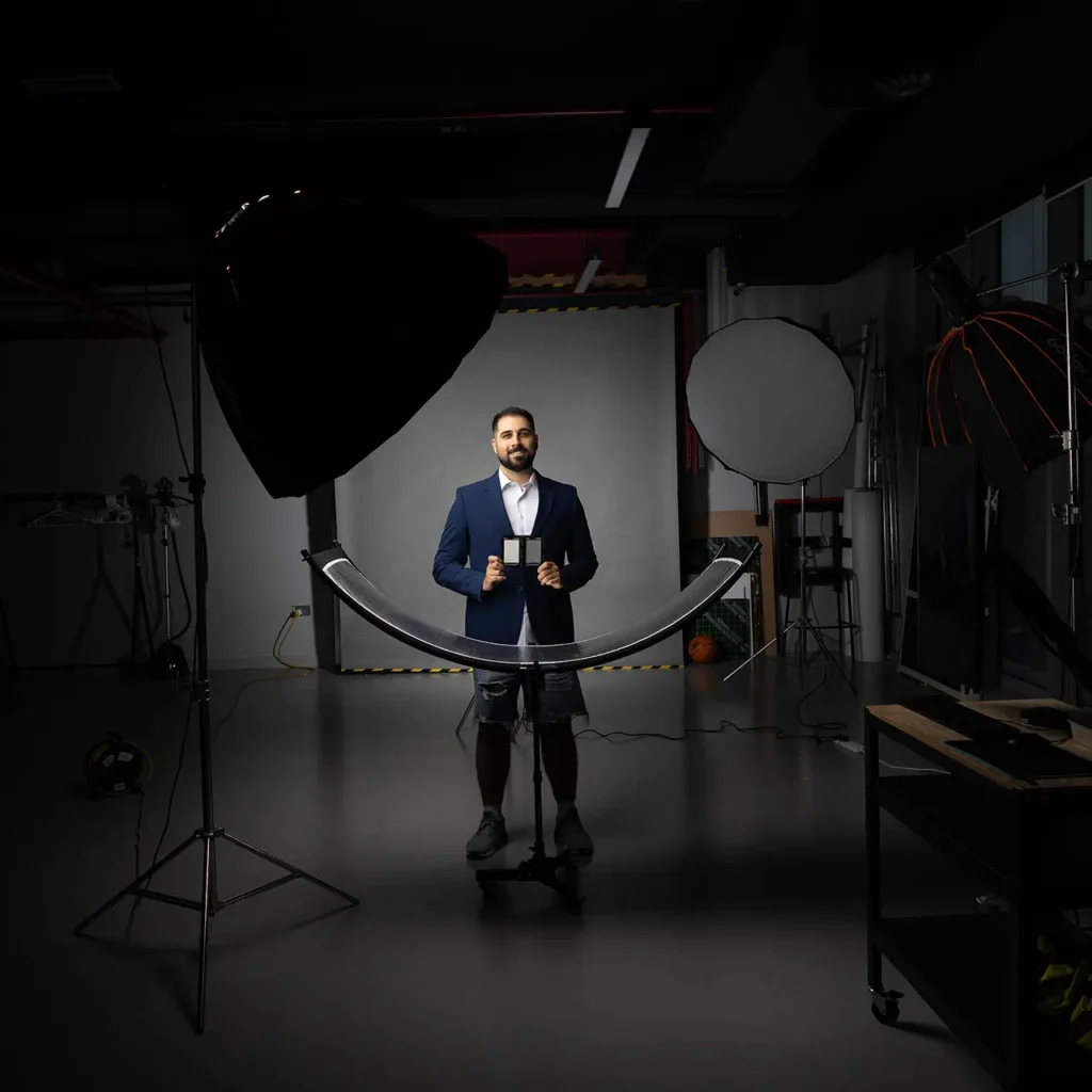 Behind the scenes of corporate headshot session with professional lighting at Masoud Raoufi photography studio Dubai