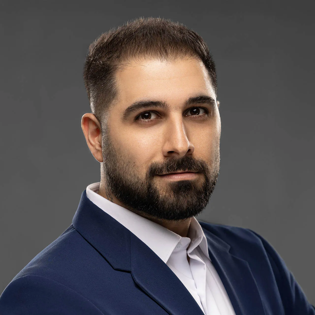 Professional corporate headshot with natural lighting and authentic expression at Masoud Raoufi studio Dubai