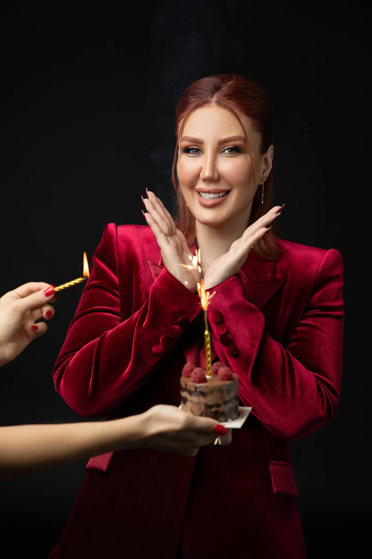 Birthday photography of a woman in a red outfit at a professional Dubai photo studio