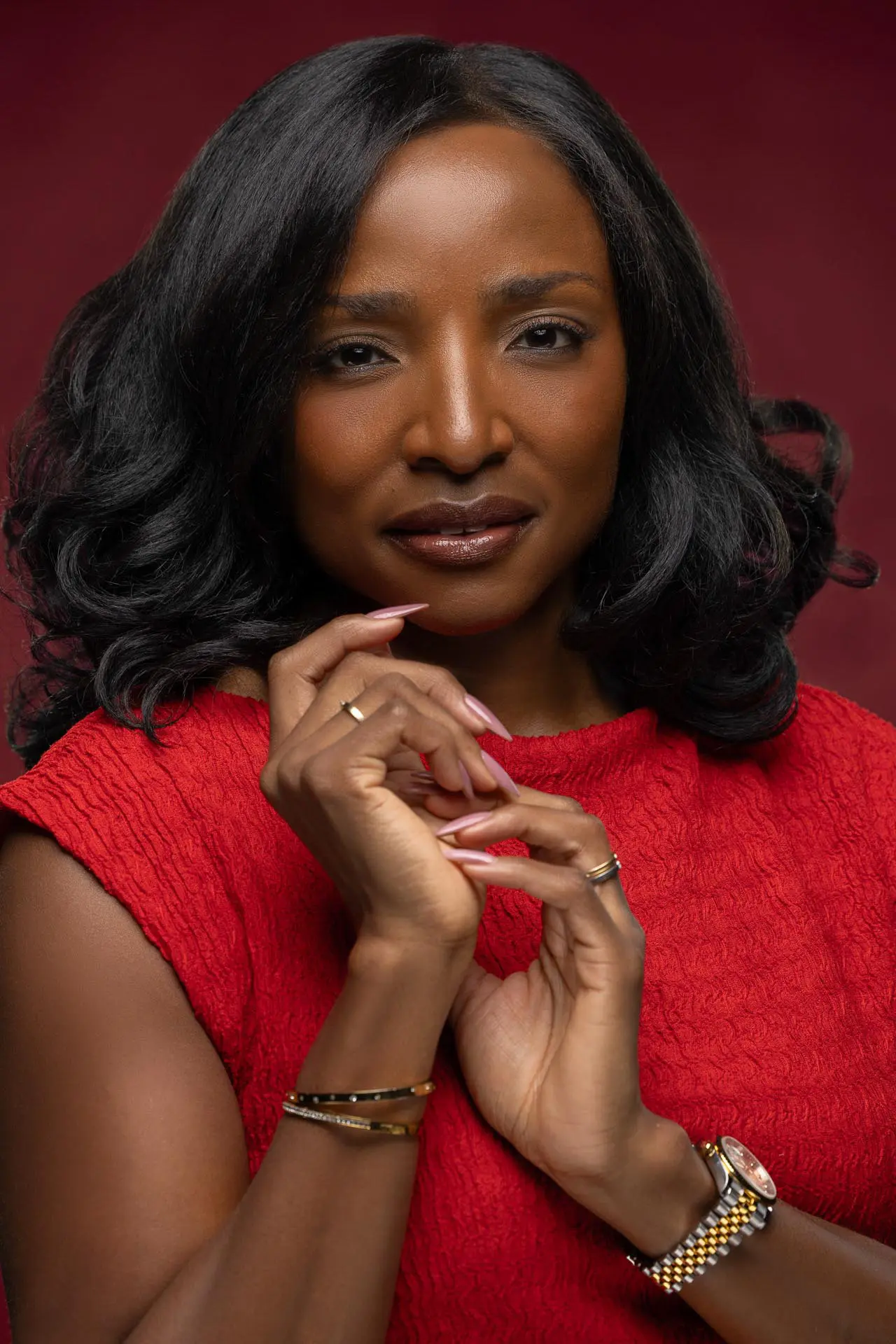 Personal branding photoshoot of a woman in a red dress at a photo studio in Dubai