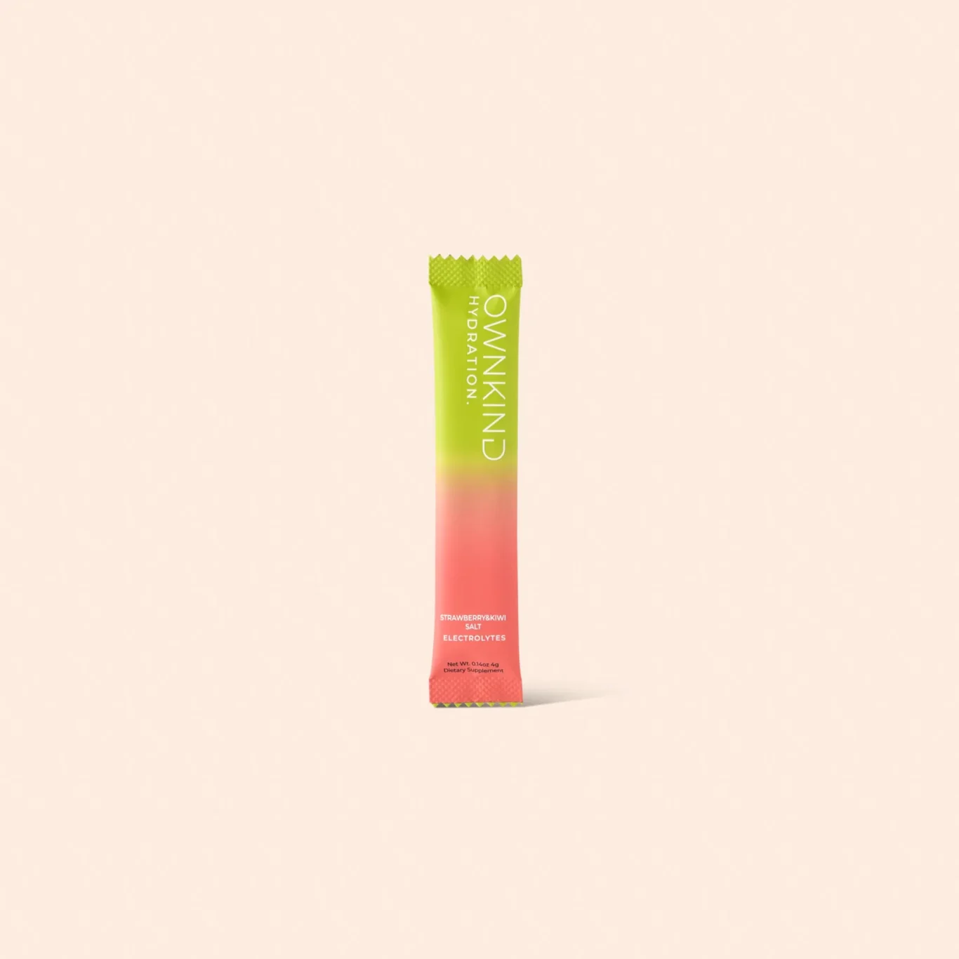 A single upright sachet with a green-to-pink gradient stands in the center against a pale peach background, showing vertical white text on the package.