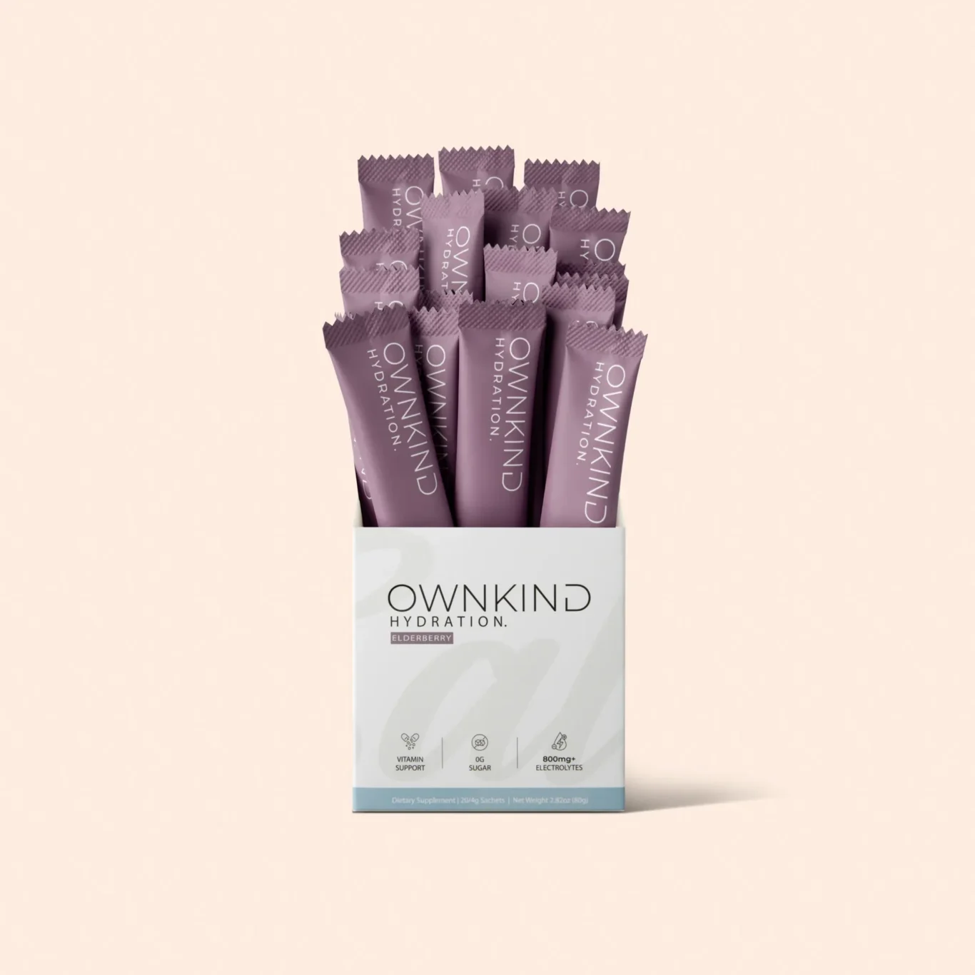 Box with many purple OWNKIND Hydration sachets, elderberry flavor, arranged upright in a white package box