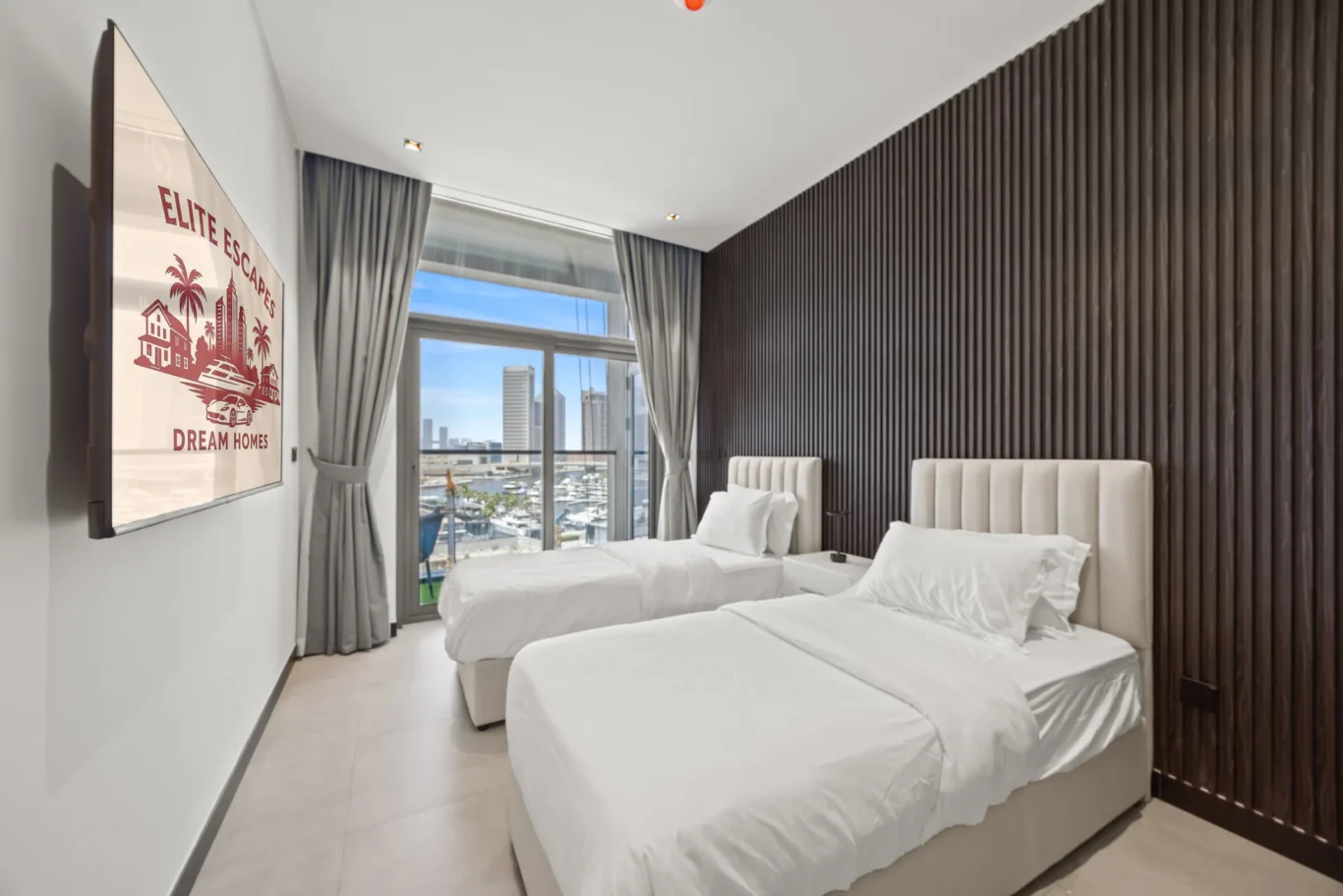 Twin hotel room with two white beds, a dark wood slat wall, and a large window showing a marina and city skyline. Curtains are drawn to the sides.