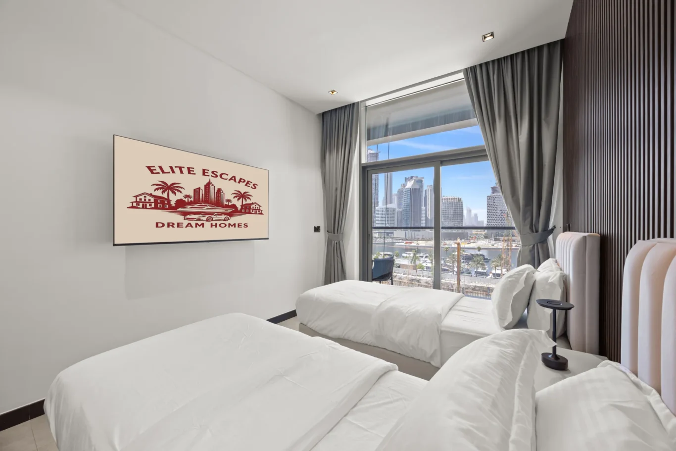 Hotel room with three white beds, large window showing a city skyline, and a wall poster reading 'Elite Escapes Dream Homes'