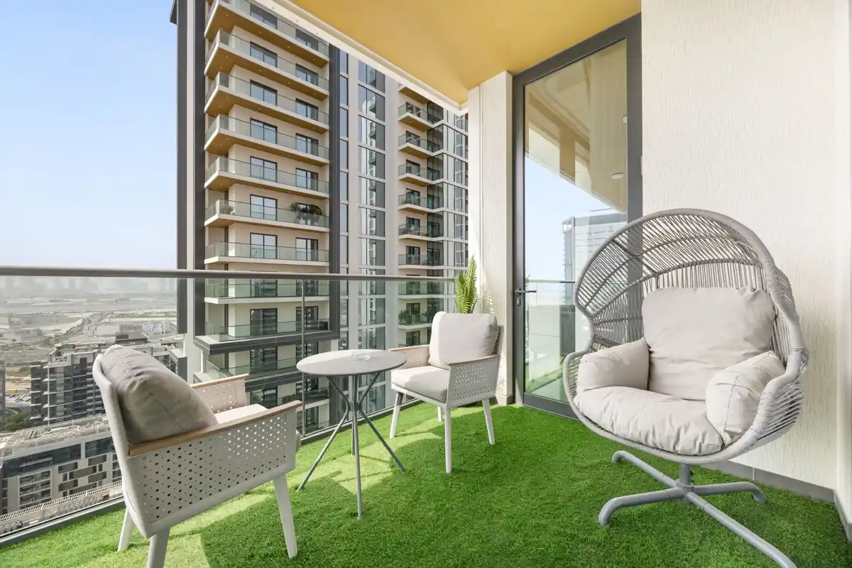 Balcony with seating and Downtown Dubai skyline, Airbnb at Crest Grande, Sobha Hartland, daylight