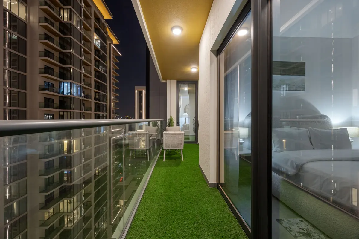Balcony at night with the Burj Khalifa light show, Airbnb at Crest Grande, Sobha Hartland, Dubai