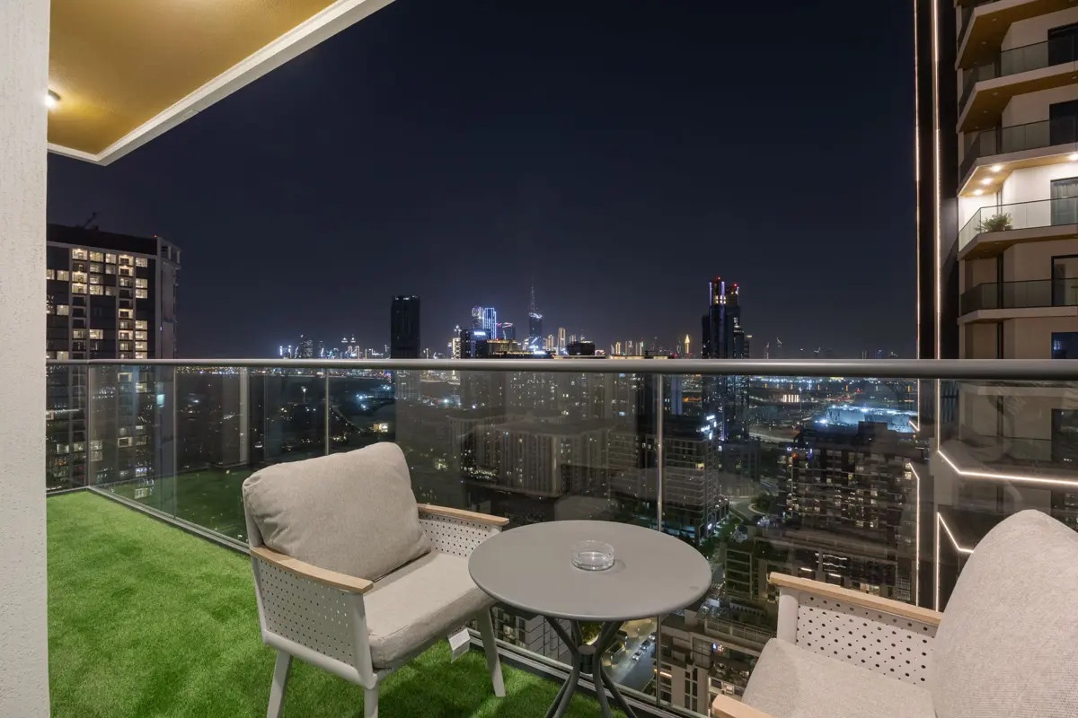 Balcony at night with the Burj Khalifa light show, Airbnb at Crest Grande, Sobha Hartland, Dubai