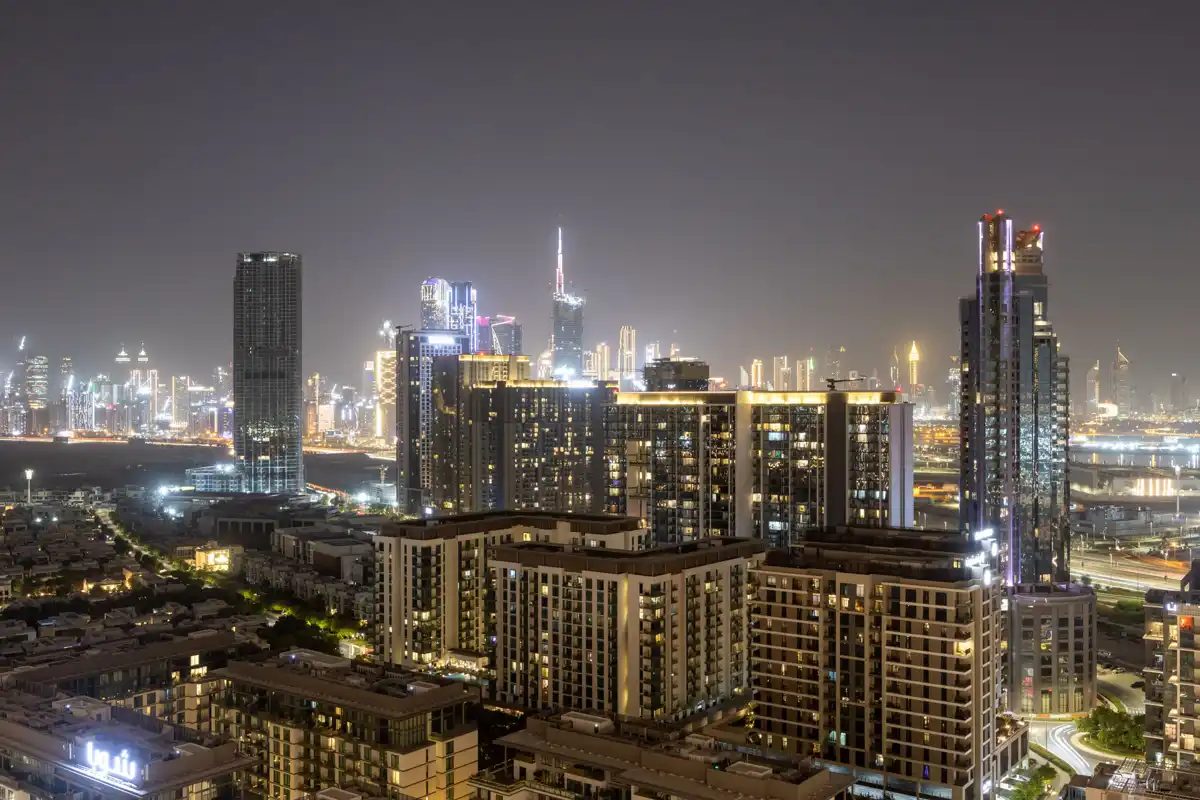 Balcony at night with the Burj Khalifa light show, Airbnb at Crest Grande, Sobha Hartland, Dubai