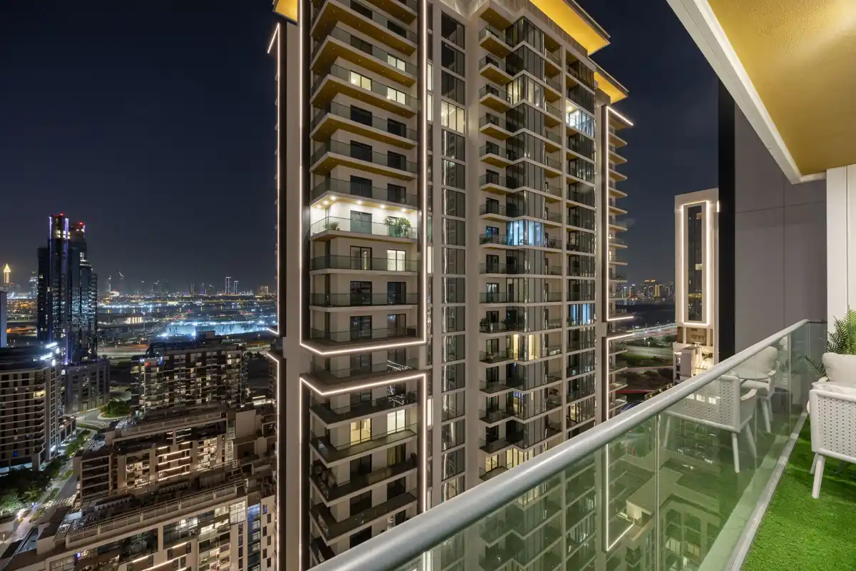 Balcony at night with the Burj Khalifa light show, Airbnb at Crest Grande, Sobha Hartland, Dubai