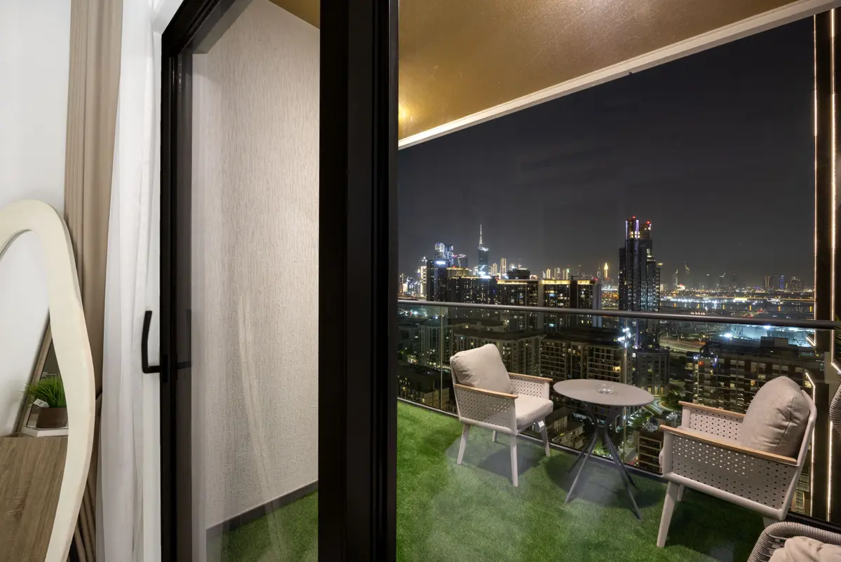 King bedroom and balcony at night, Airbnb at Crest Grande, Sobha Hartland, Dubai