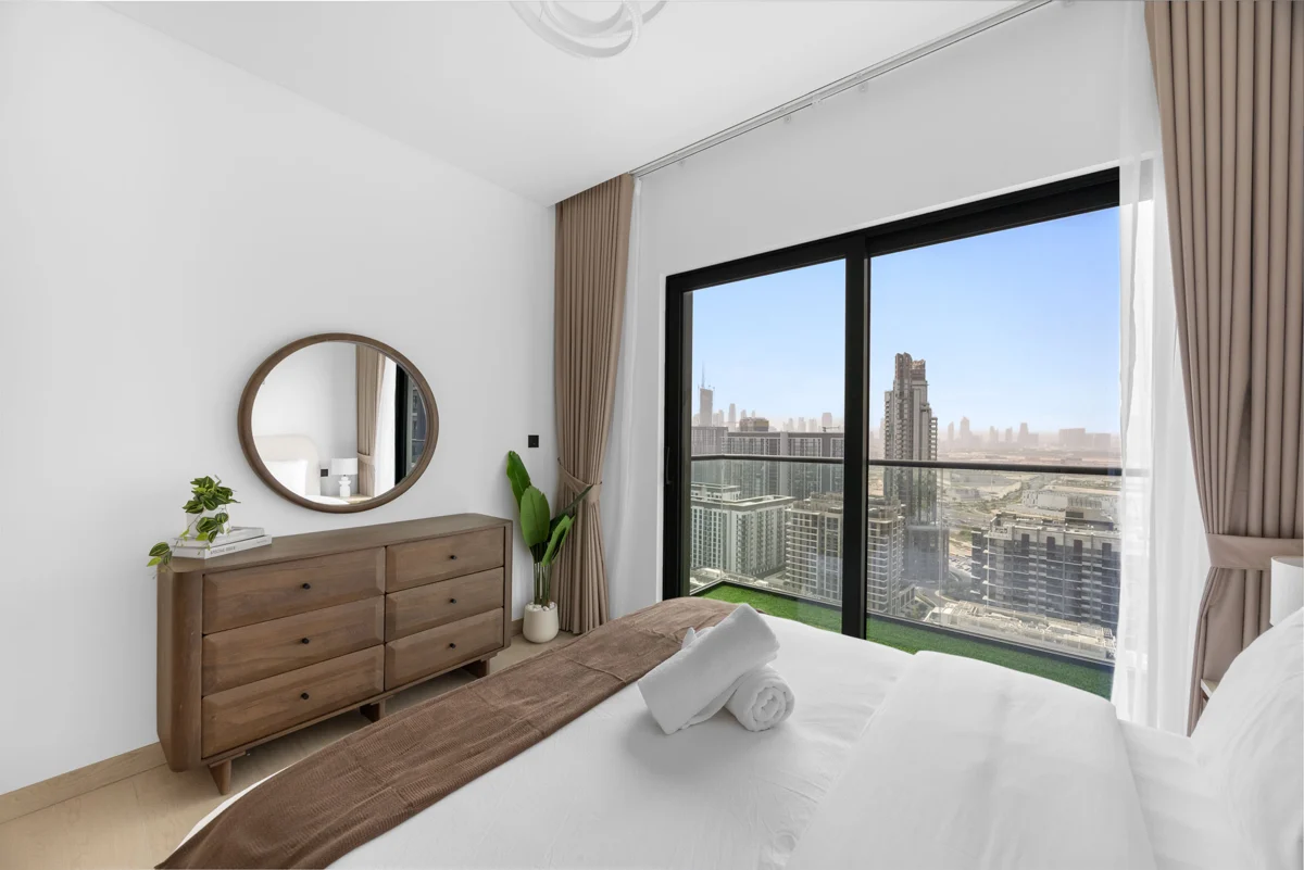 Queen bedroom with dresser and Downtown view, Airbnb at Crest Grande, Sobha Hartland, daylight