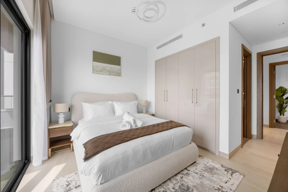 Queen bedroom with dresser and Downtown view, Airbnb at Crest Grande, Sobha Hartland, daylight