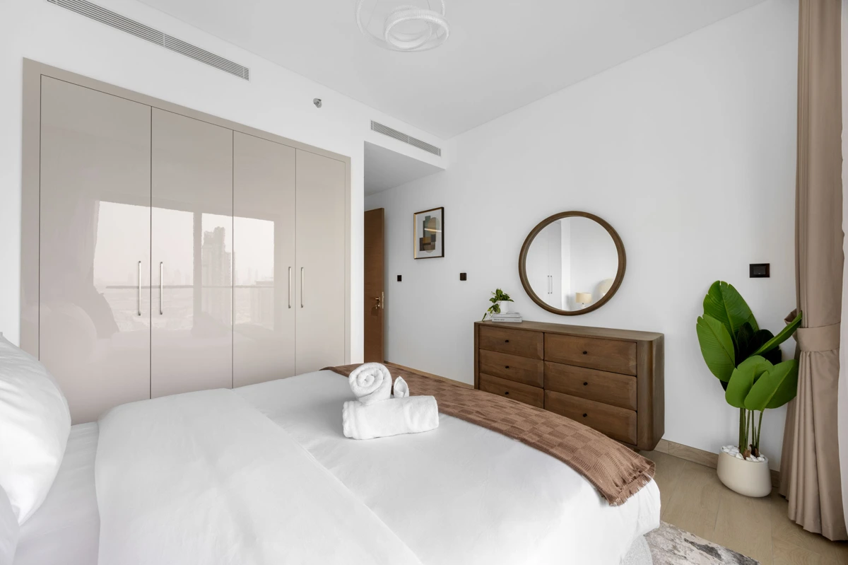 Queen bedroom with dresser and Downtown view, Airbnb at Crest Grande, Sobha Hartland, daylight