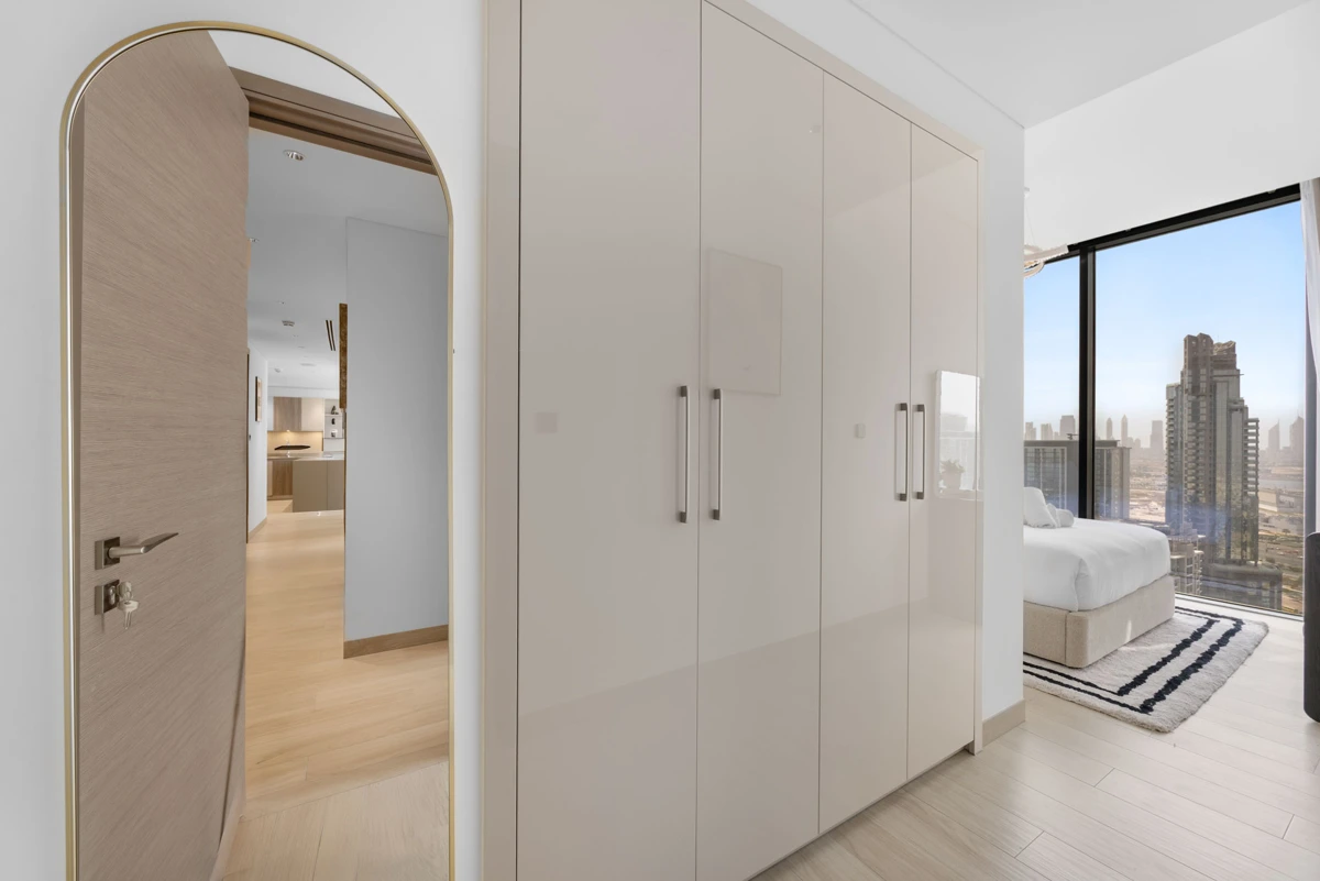 Third bedroom with queen bed and wardrobe, Airbnb at Crest Grande, Sobha Hartland, daylight