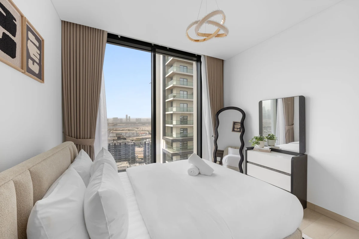 Third bedroom with queen bed and wardrobe, Airbnb at Crest Grande, Sobha Hartland, daylight