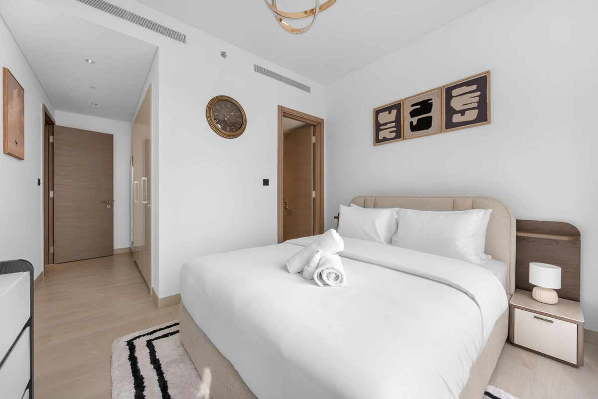 Third bedroom with queen bed and wardrobe, Airbnb at Crest Grande, Sobha Hartland, daylight
