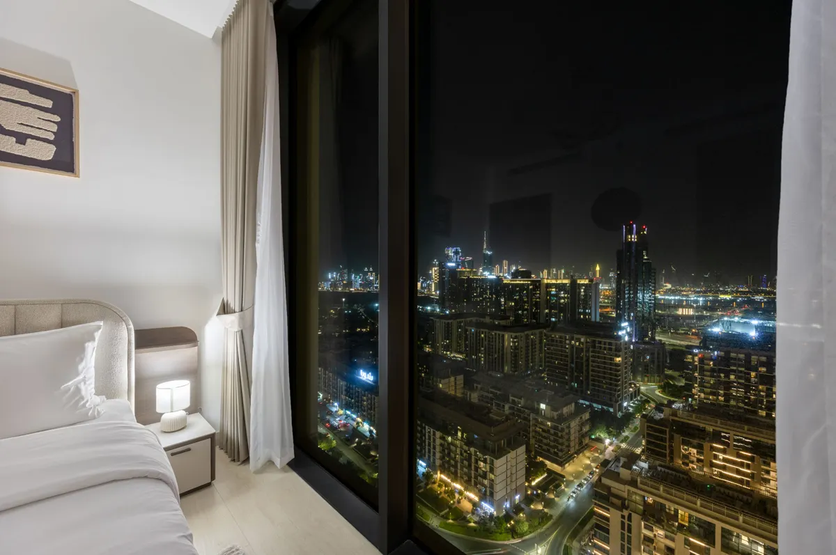 Third bedroom at night and the Downtown view, Airbnb at Crest Grande, Sobha Hartland