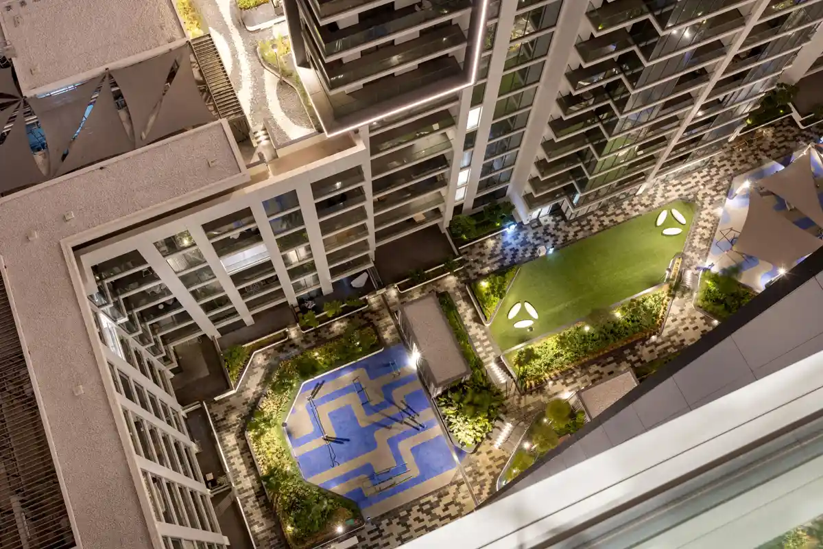 Crest Grande courtyard and pool from above at night, Sobha Hartland, Dubai