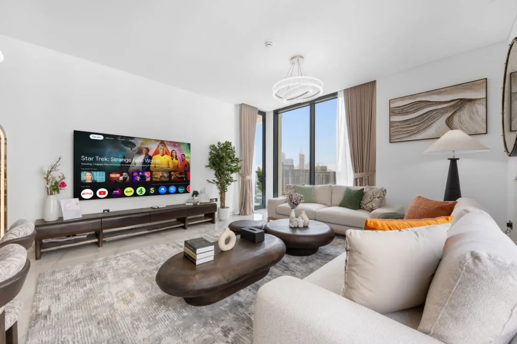 Living room of a 3-bedroom Airbnb at Crest Grande, Sobha Hartland, Dubai, the operator's cover photo