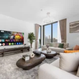 Living room of a 3-bedroom Airbnb at Crest Grande, Sobha Hartland, Dubai, the operator's cover photo