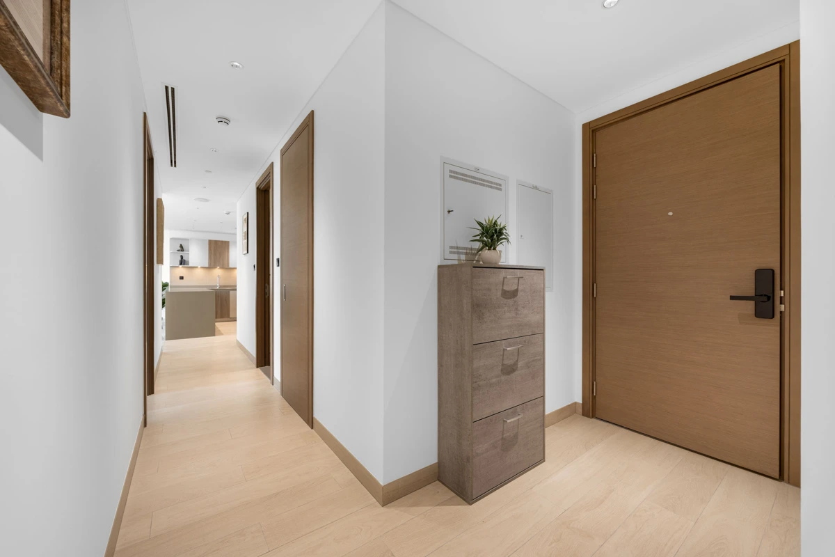 Entrance hallway and travel cot, Airbnb apartment at Crest Grande, Sobha Hartland, Dubai