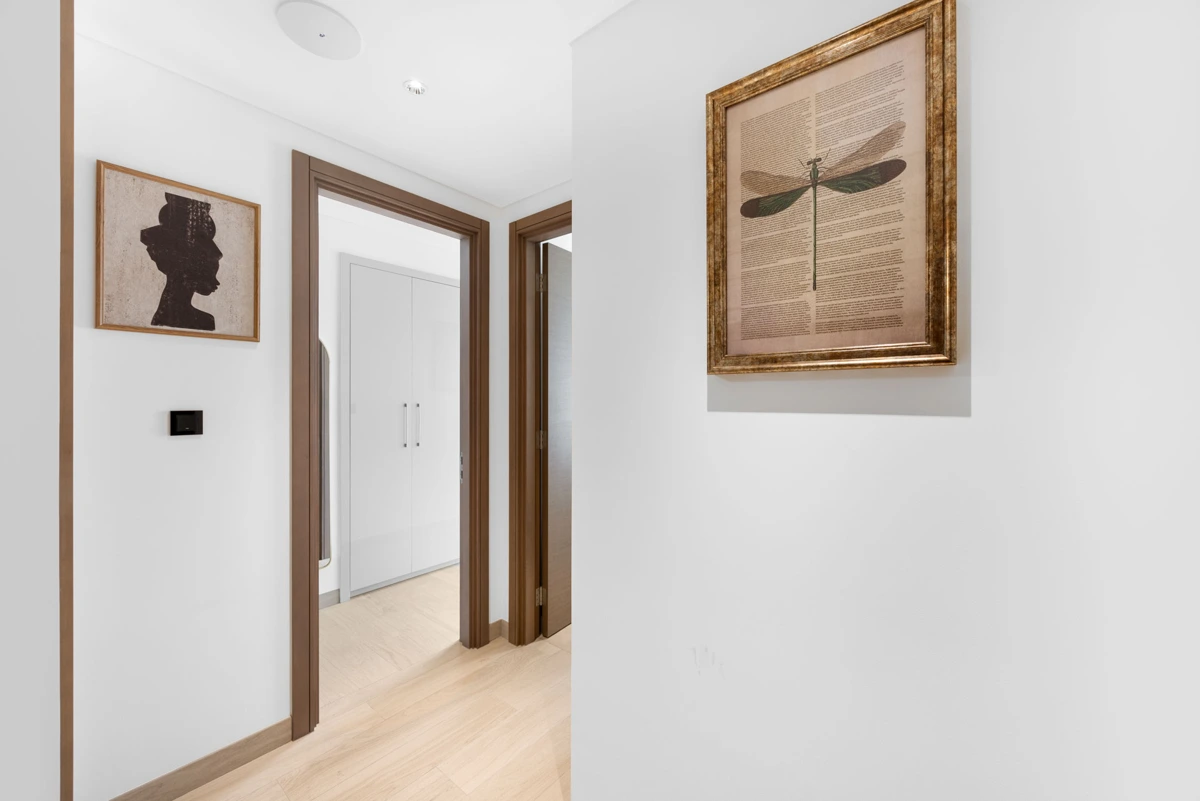 Entrance hallway and travel cot, Airbnb apartment at Crest Grande, Sobha Hartland, Dubai