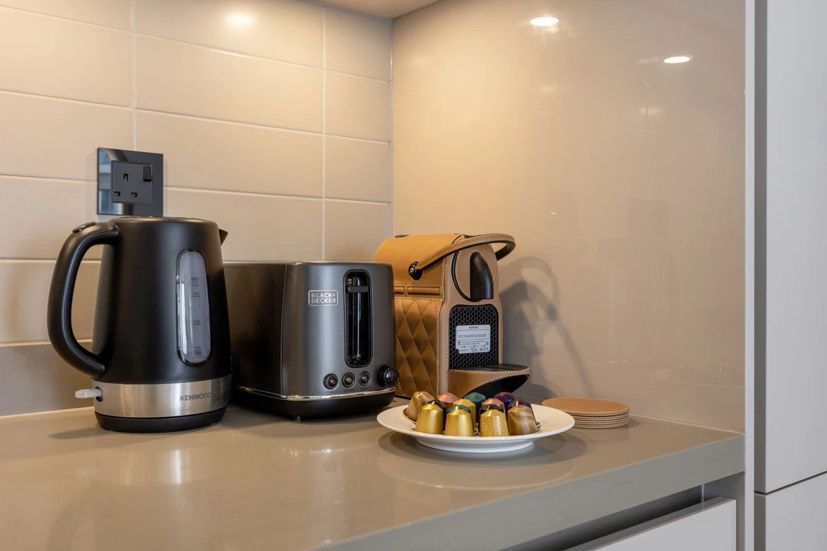 Airbnb kitchen photography at Crest Grande, Sobha Hartland, Dubai: appliances and counters in daylight