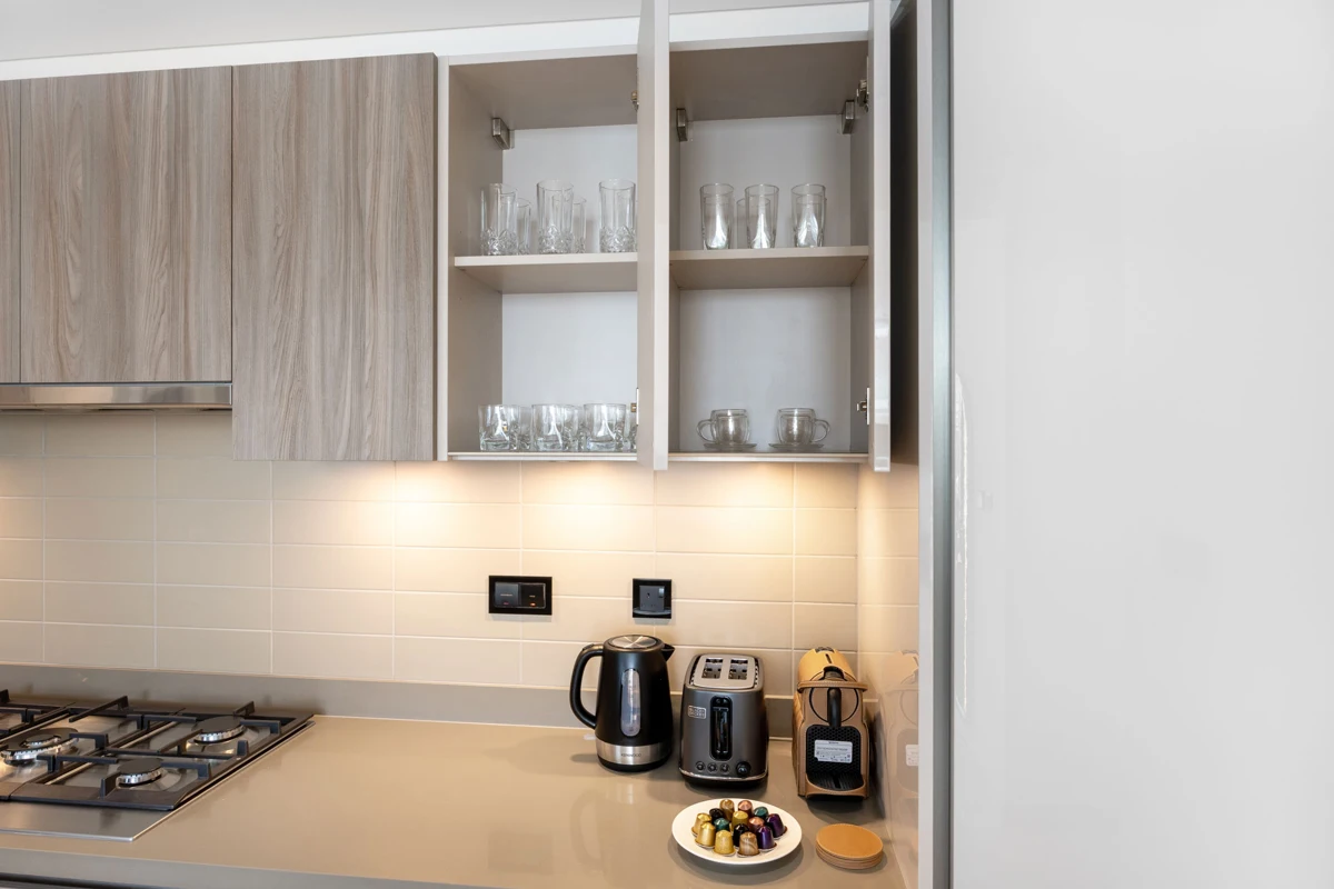 Kitchen detail photo for Airbnb listing: cupboards, dishwasher and cutlery, Crest Grande, Sobha Hartland
