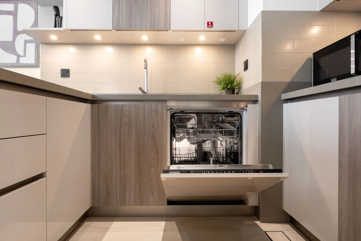 Kitchen detail photo for Airbnb listing: cupboards, dishwasher and cutlery, Crest Grande, Sobha Hartland