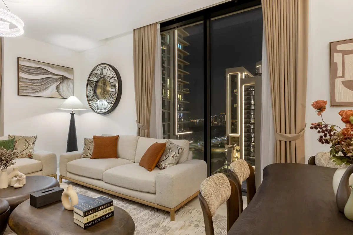 Living room, kitchen and dining at night with city lights, Airbnb at Crest Grande, Sobha Hartland