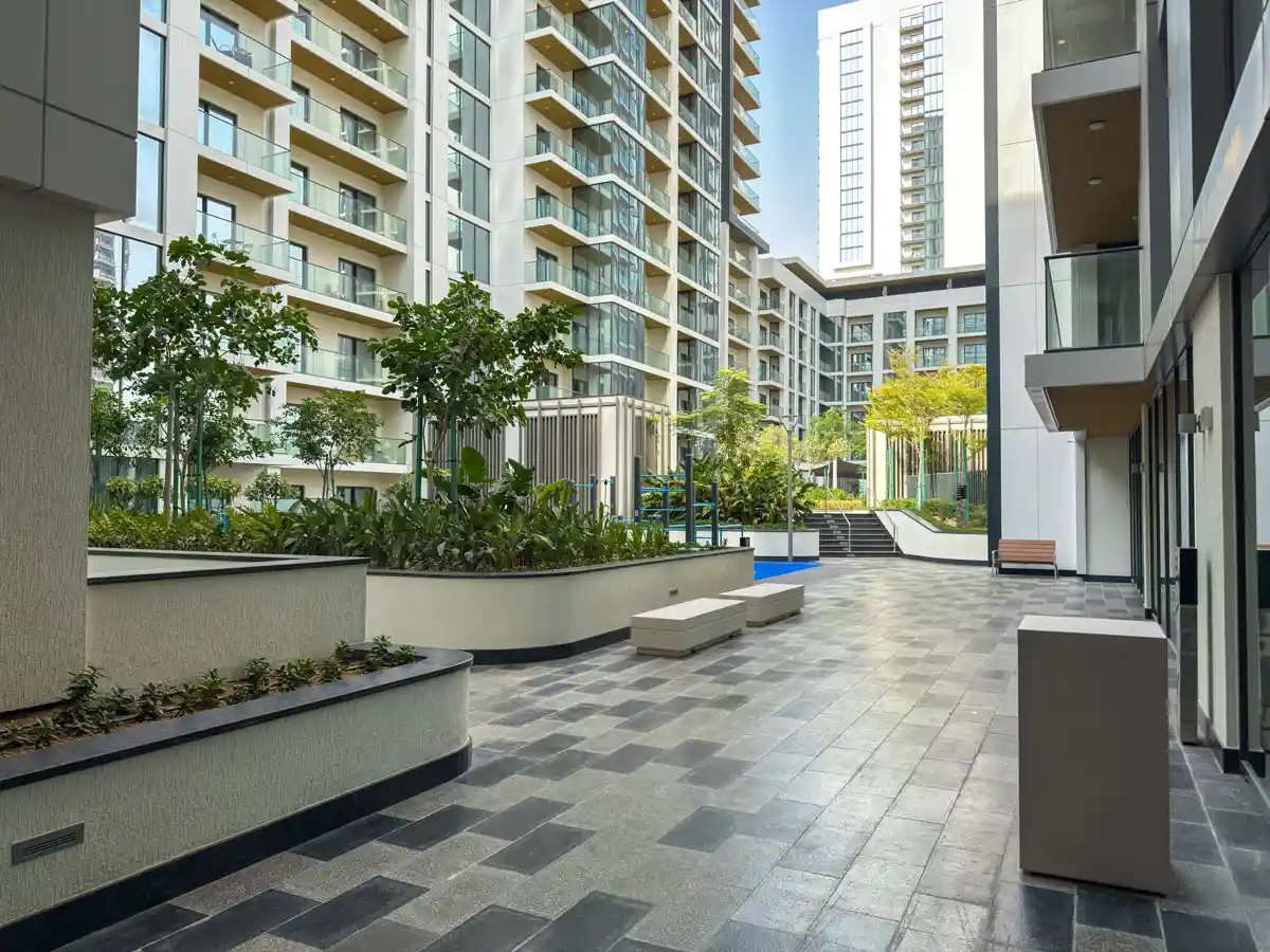 Podium amenities at Crest Grande, Sobha Hartland: outdoor gym, kids playground and lawn, Airbnb photography