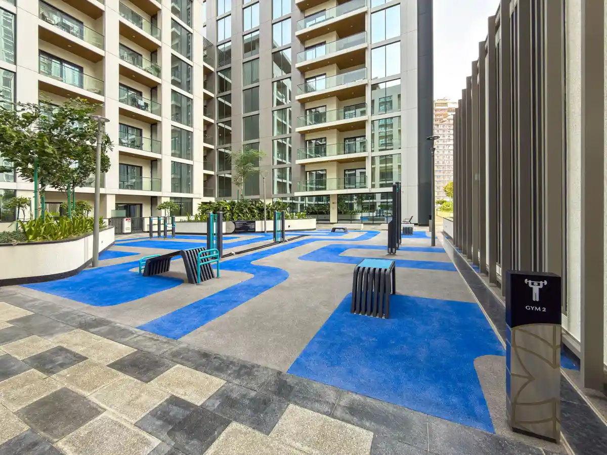 Podium amenities at Crest Grande, Sobha Hartland: outdoor gym, kids playground and lawn, Airbnb photography