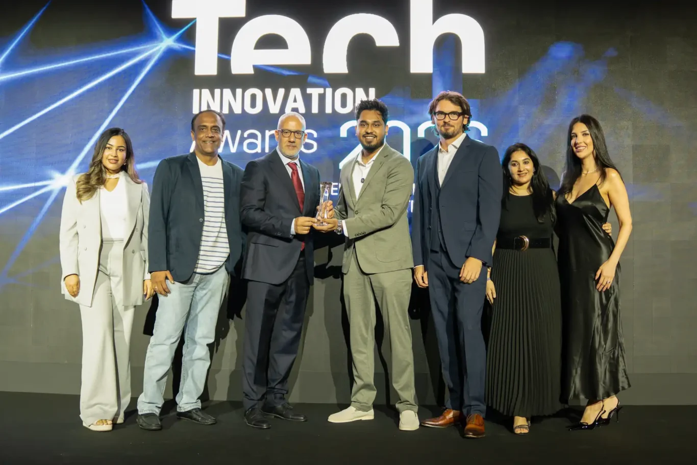 FundedNext team on stage receiving the Best Fintech Innovation award. Event photography by MRPS for FundedNext at the Tech Innovation Awards 2026, Al Habtoor Palace, Dubai.