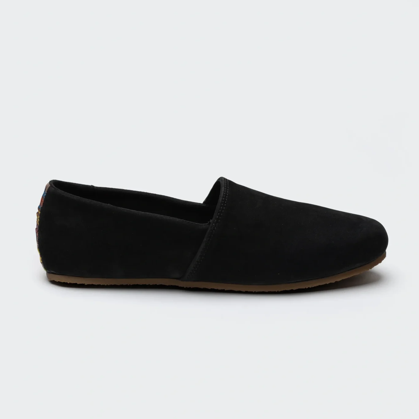 Side profile of a black SWAVE slip-on shoe. E-commerce shoe photography for SWAVE by MRPS in Dubai.