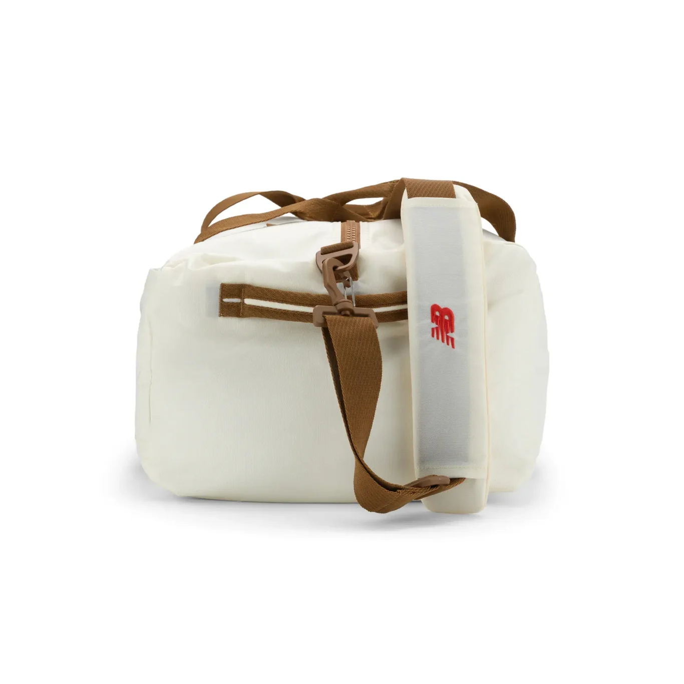 Side view of the white New Balance duffel bag showing the shoulder strap. E-commerce product photography for New Balance by MRPS in Dubai.