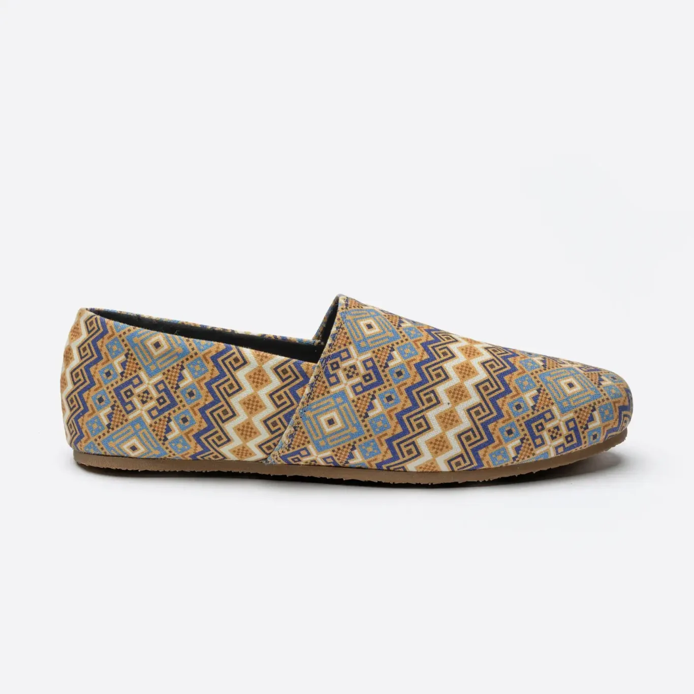 Side profile of a SWAVE slip-on in a sand and blue pattern. E-commerce shoe photography for SWAVE by MRPS in Dubai.