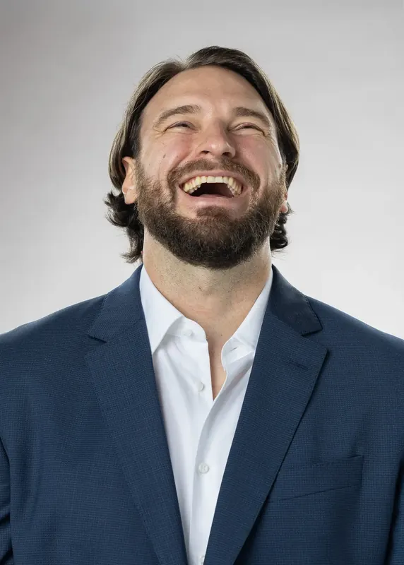 Laughing expression with head tilted back. White background reference photo from an AI model training photoshoot at the MRPS studio in Dubai.