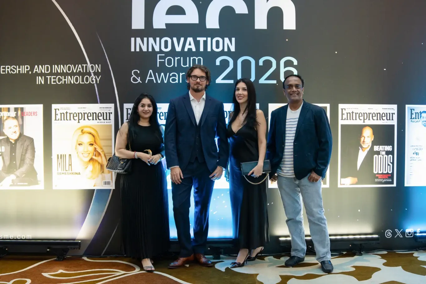 Team photo in front of the Tech Innovation Forum and Awards backdrop. Event photography by MRPS for FundedNext at the Tech Innovation Awards 2026, Al Habtoor Palace, Dubai.