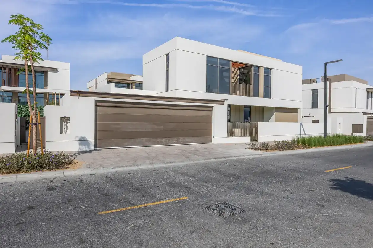 Street view of the villa and neighbouring homes in the community. Villa photography by MRPS in Dubai for ELITE Property Brokerage.
