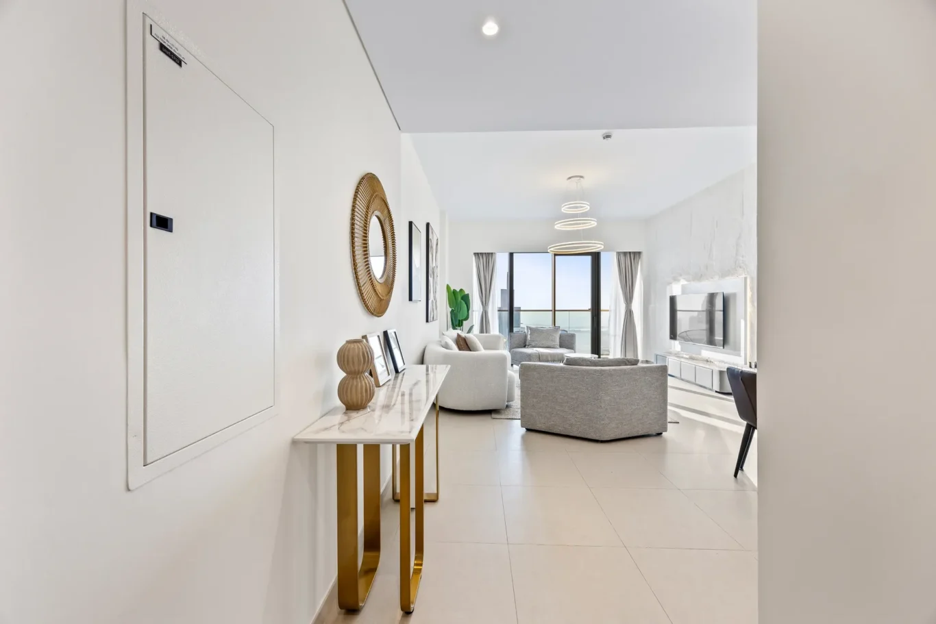 View from the entrance console through to the bright living room. Airbnb photography by MRPS for Solea Stay in Dubai.