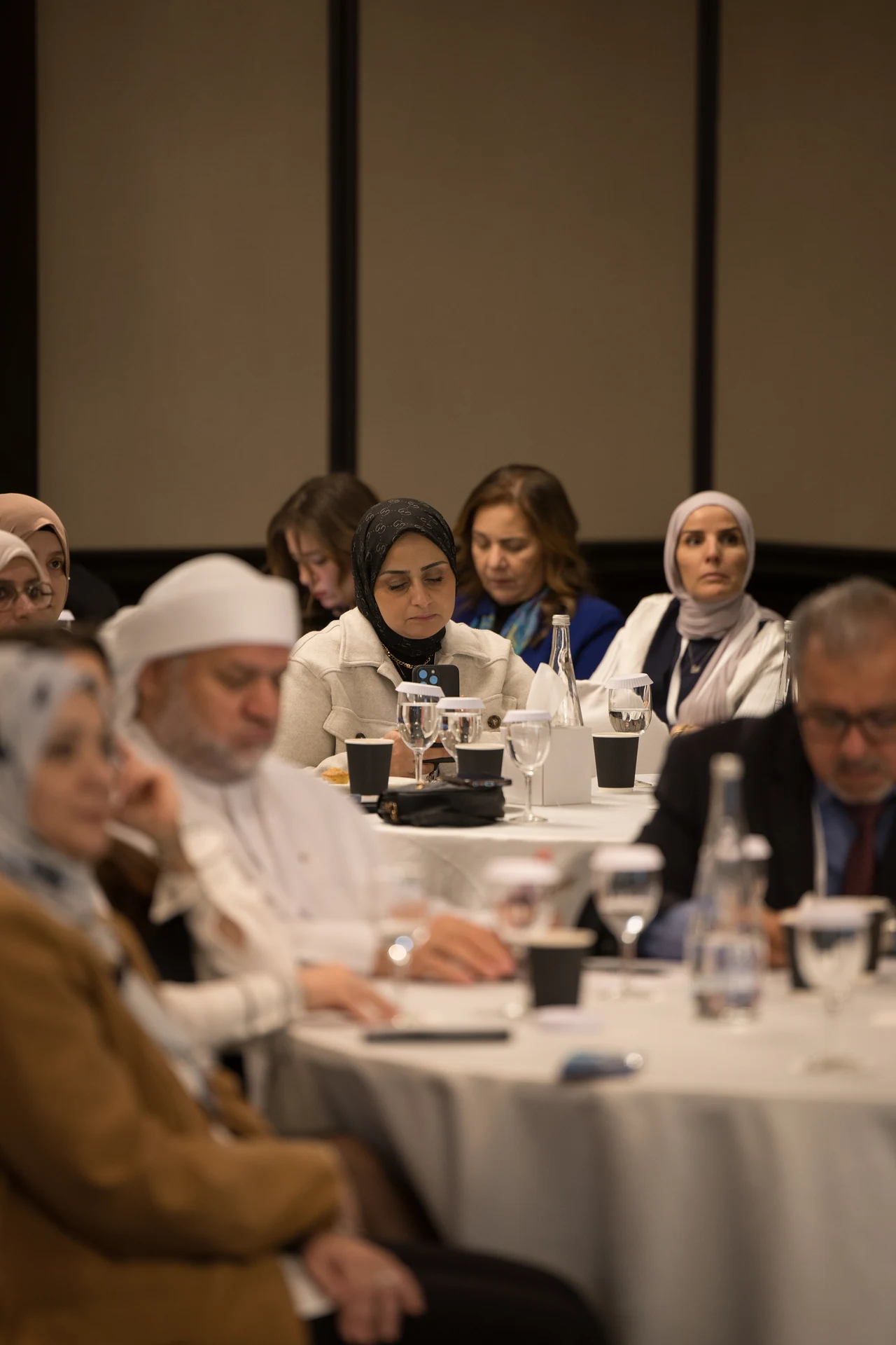 Teachers and educators at their tables following a presentation. Corporate event photography by MRPS for My Arabic Publishing at Movenpick Grand Al Bustan, Dubai.