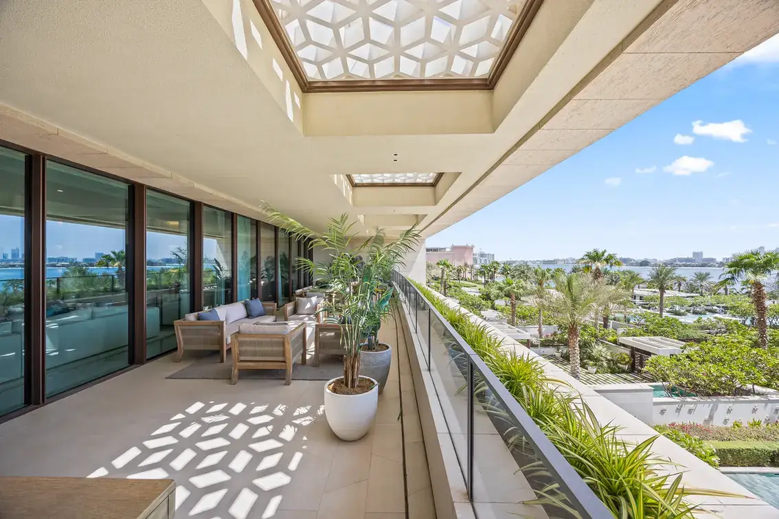 Long terrace with geometric skylights and planters in a furnished three-bedroom residence at Atlantis The Royal, Palm Jumeirah, photographed for Apex Homes Real Estate.