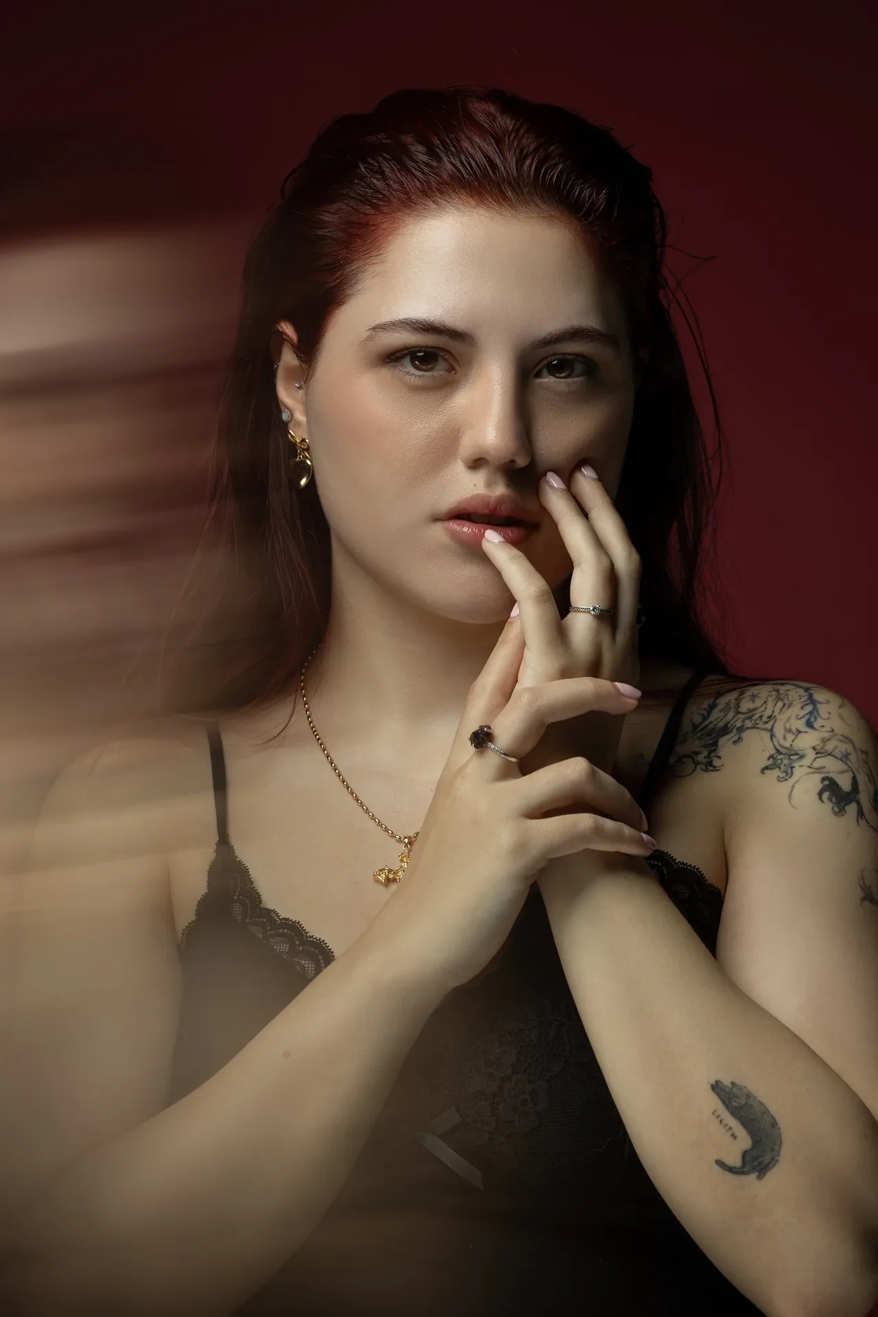 Creative motion blur portrait with hands near the face. Beauty portrait of model Julian, photographed by Nastaran at the MRPS studio in Dubai.