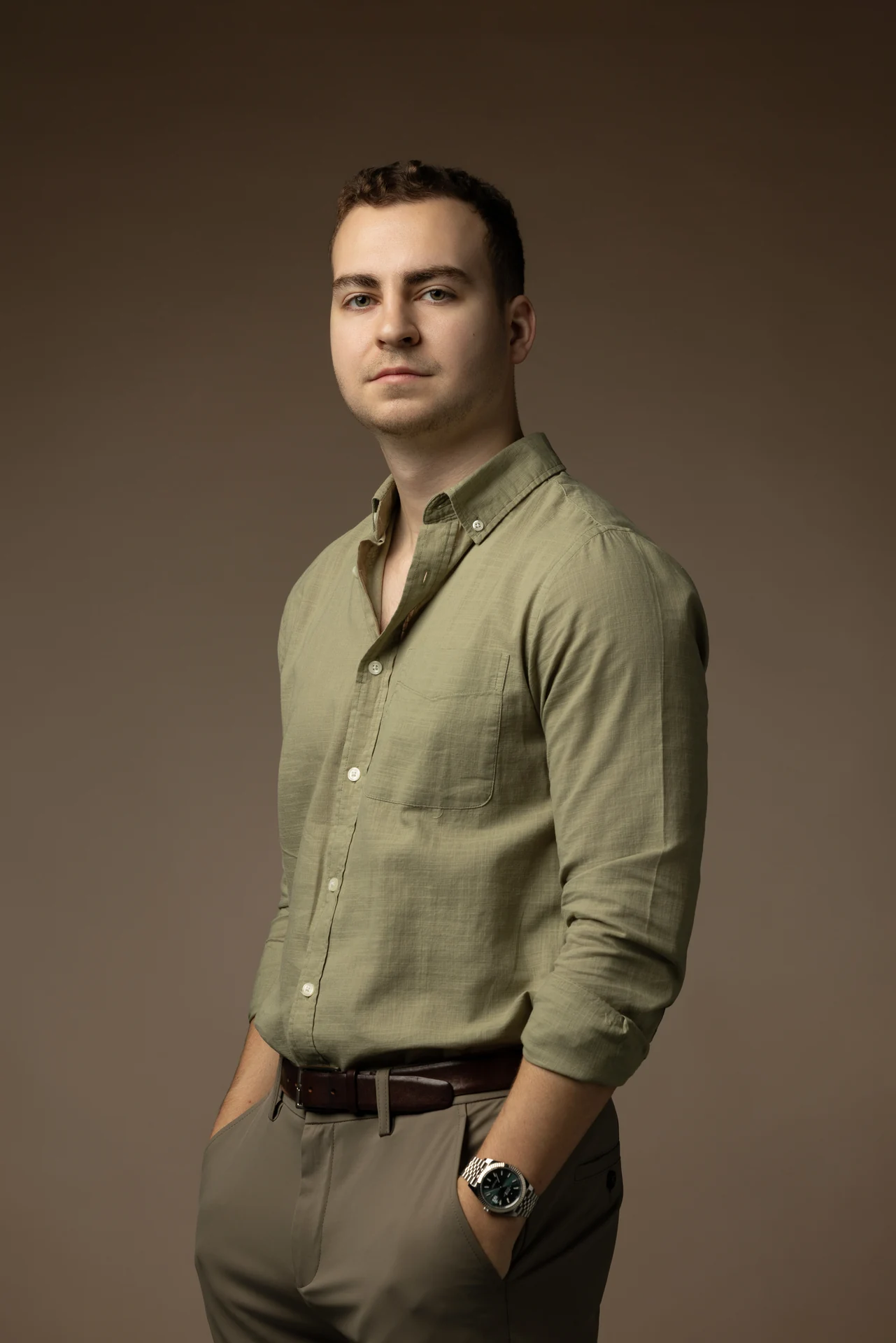 Relaxed standing portrait in an olive shirt with hand in pocket. Professional headshot of Tim Ruscica of Tech With Tim, photographed at the MRPS studio in Dubai.