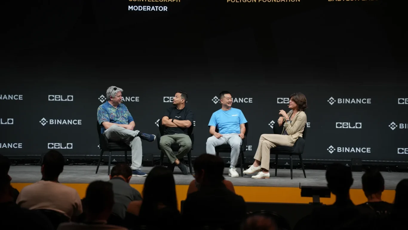 Wide view of the panel discussion on the main stage. Photographed by MRPS for Eventflare at Binance Blockchain Week 2025, Coca-Cola Arena, Dubai.