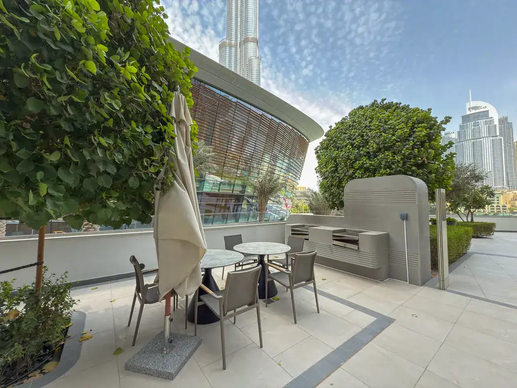Outdoor terrace with Burj Khalifa view at Grande Signature, Downtown Dubai, photographed for StayComfy Holiday Homes.